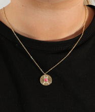 Gold pink coin pendant